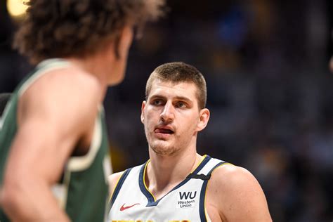 Kiszla: Nikola Jokic watches with Nuggets Nation as teammates carry him to within one victory of championship dream come true
